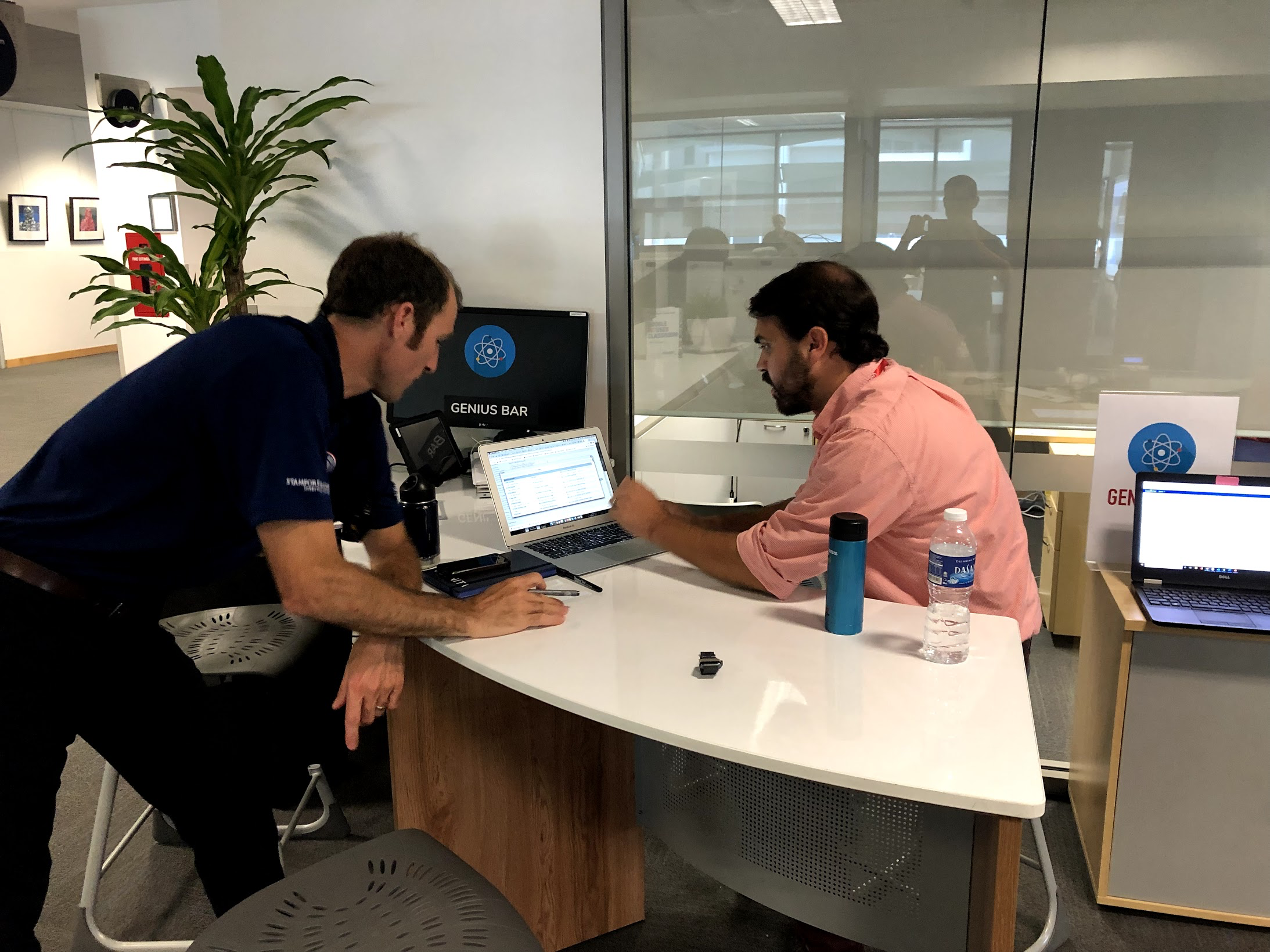 Teachers solving computer problems at the Genius Bar
